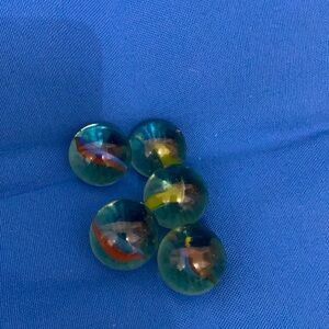 Marble TwoStyles OneYellowRedGreenSwirls YellowRedBlueSwirls Seethrough $29Each